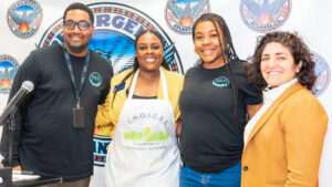 Photo shared by The Atlanta City Council on April 08, 2025 tagging @collinsforkids, and @lilianaforatlanta. Puede ser una imagen de 4 personas, personas de pie, delantal, revista y texto que dice "FIESURGENE TLANTA RF三王 RGE ATLANT URGENE R តមមំ aed PAR PAD PAD ANTA อซส 모시프 RAD TAT P C.H.O.I.C.ES C.H.O.I. d9g0% COMMUNITY TEACHING TEACHINGKITCHEN KITCHEN".