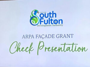 Photo by Linda Pritchett on March 24, 2025. May be an image of screen and text that says 'outh CITYOF Fult Sputh on Development Authority ARPA FAÇADE GRANT Check resentation'.