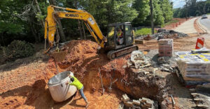 Project Progress: Trail connections are underway along Rogers Bridge Road and Bell Road, making it easier for pedestrians to easily access nearby schools and Cauley Creek Park. The project includes the installation of multi-use trails along the east side of Rogers Bridge Road from Bell Road to Amberleigh Way and along Bell Road from Cauley Creek Park to Rogers Bridge Road. Crews have installed sod and mulch and applied seed and matting to areas along Bell Road, with exception to areas where construction is taking place. Multiple stormwater management features such as drop inlets, manholes, pipes, and a bioswale have been installed. The intersection of Rogers Bridge Road and Bell Road has been realigned and lowered about five feet to improve sight distance for drivers turning onto Bell Road and increase overall driver and pedestrian safety. The right turn lane from Rogers Bridge Road onto Bell Road will be widened and the portion of sidewalk on Bell Road into the Cauley Creek Park 5K trail will be constructed. Crews will also install a Rectangular Rapid Flashing Beacon (RRFB) at the crosswalk on Bell Road and Rogers Bridge Road. Construction is expected to be complete this summer. Stay updated on project progress by signing up for email alerts: https://bit.ly/3viPSv5 and visit and city website: https://bit.ly/4cqs8pq