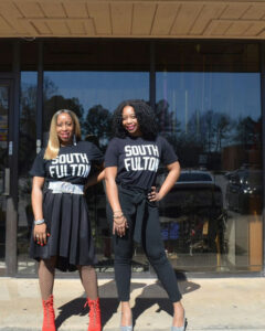 Photo shared by Visit City of South Fulton on April 01, 2025 tagging @_southfultonstudios, @oldnationaldistrict, and @southfultonstudiosproductions. Pode ser um gráfico de 2 pessoas, meias arrastão e texto que diz "SOUTH FU! FULTDN TD SOUTH FULTON".