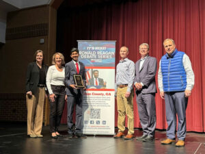 Photo shared by Fulton County Schools on March 13, 2025 tagging @milton_high_. Puede ser una imagen de 7 personas, oficina y texto.