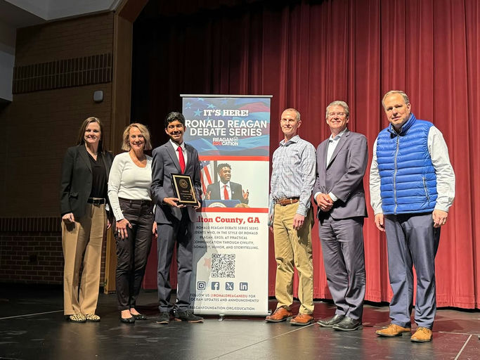 Photo shared by Fulton County Schools on March 13, 2025 tagging @milton_high_. Puede ser una imagen de 7 personas, oficina y texto.