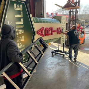 Photo by Source Urbanism on February 24, 2025. May be an image of 3 people, service vehicle, signboard, rack, forklift and text.