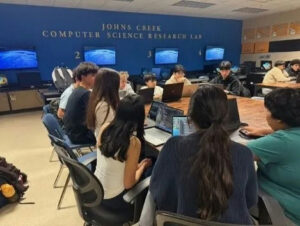 Photo by Fulton County Schools on March 13, 2025. May be an image of 7 people, people studying, screen and text.