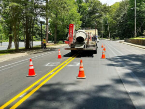 Photo by ATLDOT on May 08, 2025. May be an image of 1 person, icecream cone, road, curb and text.