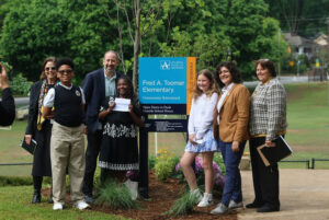Photo by Atlanta Public Schools on May 08, 2025. May be an image of 7 people, people standing, grass, park and text that says 'Δ SCDOLS LOCLE 0 Fred A. Toomer កាកត 5 Elementary Community CommunitySchoo.lyard Schoolyard Open Dawn Dusk School Hours 1 HALAA KaLE'.
