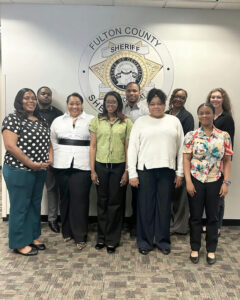 Photo by Fulton County Sheriff's Office on May 08, 2025. May be an image of ‎5 people, people standing, office and ‎text that says '‎FULTON EULTONCOUNTY FULTON SHERIF SHERIFA ERIFE COUNTY dE F 01 የ.ንትግ מדיניעולתם S E‎'‎‎.