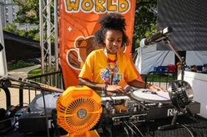 Photo by 202Creates 🎨🎬🎸 on May 13, 2025. May be an image of 1 person, tambourine, crowd and text.