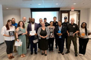 A group photo of the employees who were recognized at the event.