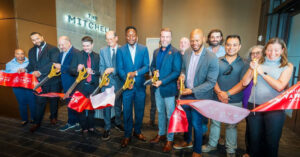 Photo by The Atlanta City Council on September 08, 2025. May be an image of 9 people, flag, office and text that says 'MITCHEU THE ጥር'.