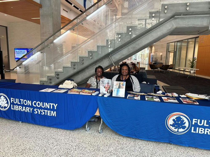 Photo by Fulton County Library System on October 06, 2025. May be an image of 3 people, book, office and text.