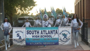 Photo shared by @kbsahbtv on November 03, 2025 tagging @apssatlanta, and @apsitandrea. May be an image of clarinet, banner and text that says 'SOUTH SA S, SOUTH ATLANTA MARCHING HIGH SCHOOL ON A MISSION 0000 TO OUR VISION HORNETS 素 ATLANTA, GEORGIA'.