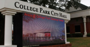 Photo by Neighbor Newspapers on December 15, 2025. May be an image of screen, banner, signboard, park and text.