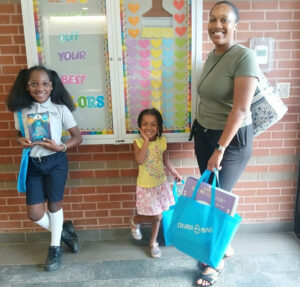 Photo by Fulton County Library System on September 16, 2025. May be an image of 3 people, child, people smiling, book and text.